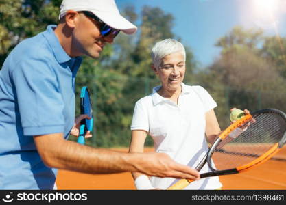 Mature Woman Playing Tennis