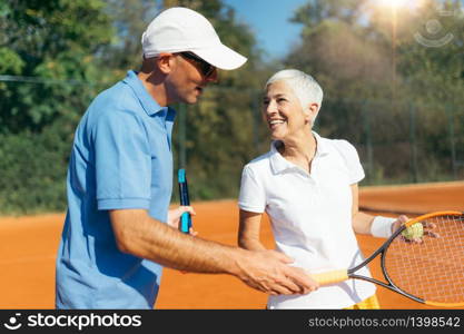 Mature Woman Playing Tennis