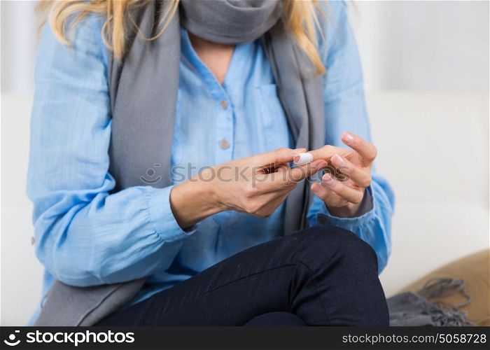 mature woman put plaster bandage on finger cut