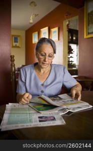 Mature woman reading a newspaper