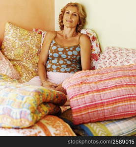 Mature woman resting on the bed