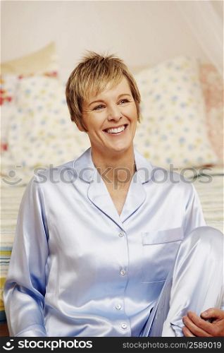 Mature woman sitting and smiling