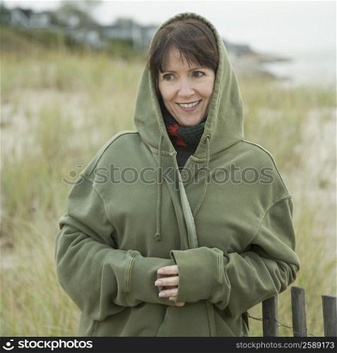 Mature woman smiling on the beach