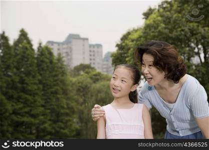 Mature woman smiling with her granddaughter