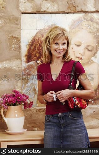 Mature woman standing and smiling