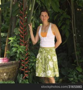 Mature woman standing in a garden
