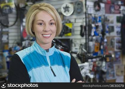 Mature woman stands in bike shop