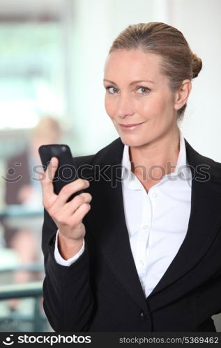 Mature woman using smartphone
