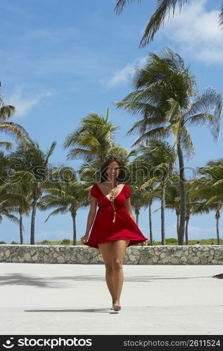Mature woman walking on the beach, South Beach, Miami Beach, Florida, USA
