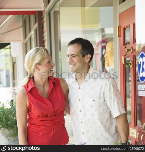 Mature woman with a mid adult man smiling