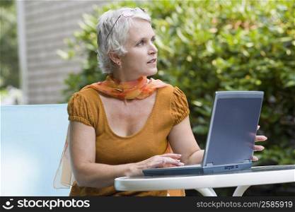 Mature woman working on a laptop