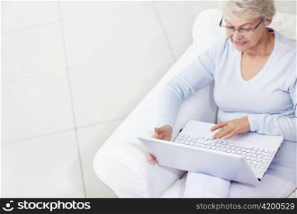 Mature woman working with laptop
