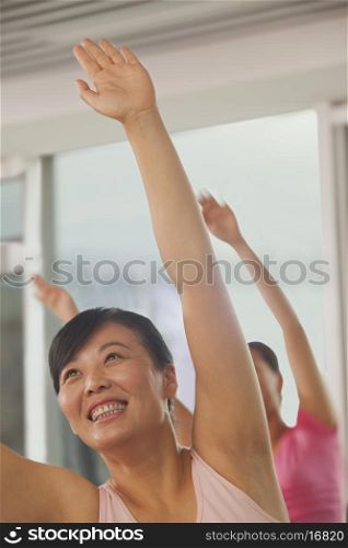 Mature women exercising in the gym