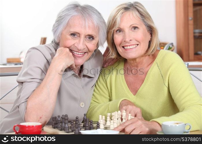 mature women playing chess