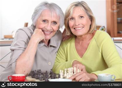 mature women playing chess