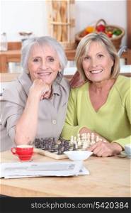 Mature women playing chess