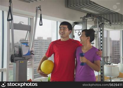 Mature women with her trainer after working out