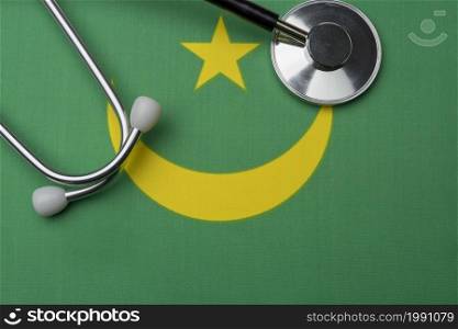 Mauritania flag and stethoscope. The concept of medicine. Stethoscope on the flag as a background.. Mauritania flag and stethoscope. The concept of medicine.