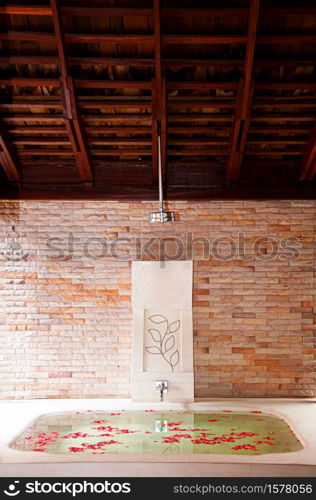 MAY 2, 2010 Pattaya, Thailand - Wellness and health spa therapy bathtub full with rose flowers in tropical Thai resort, Hospitality and tourism business