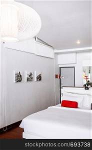MAY 22,2014 Koh Lanta, Krabi, Thailand - White modern minimal bedroom interior with picture frame and furniture. Modern simple and clean interior design