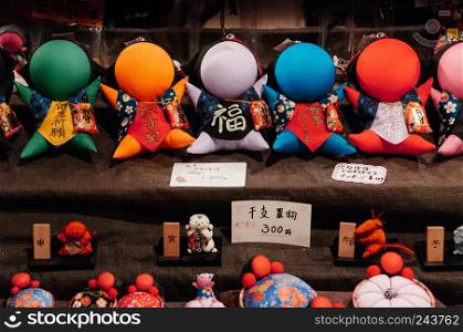 MAY 26, 2013 Takayama, Gifu, JAPAN - Japanese Sarubobo doll famous souvenir, red fabric doll use as amulet for kid mostly made by mother or grandmotheruse
