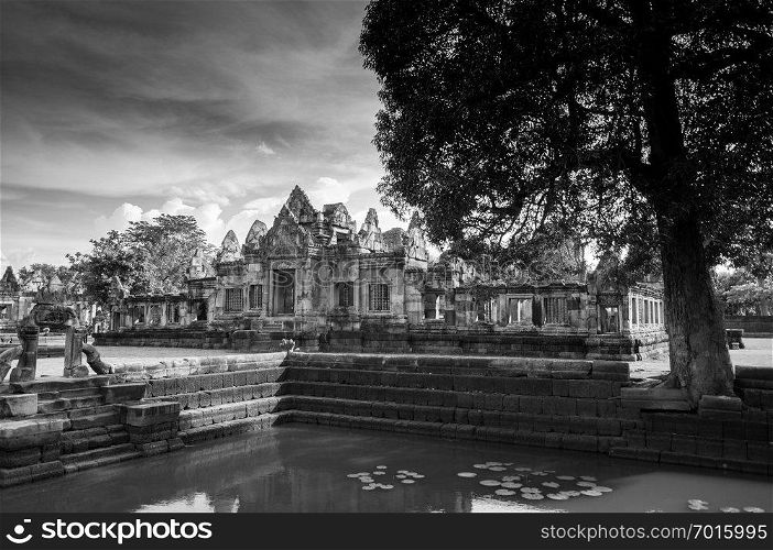MAY 30, 2014 Buriram, Thailand - Ruined sandstone temple of Prasat Muang Tam castle and Barai pond use as water reservoir. A Thousand years ancient Khmer architecture.