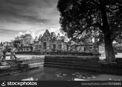 MAY 30, 2014 Buriram, Thailand - Ruined sandstone temple of Prasat Muang Tam castle and Barai pond use as water reservoir. A Thousand years ancient Khmer architecture.