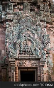 MAY 31, 2014 Buriram, Thailand - Carved sandstone facade from Ramayana epic story. Ancient Khmer architecture of  thousand years Phanom Rung castle