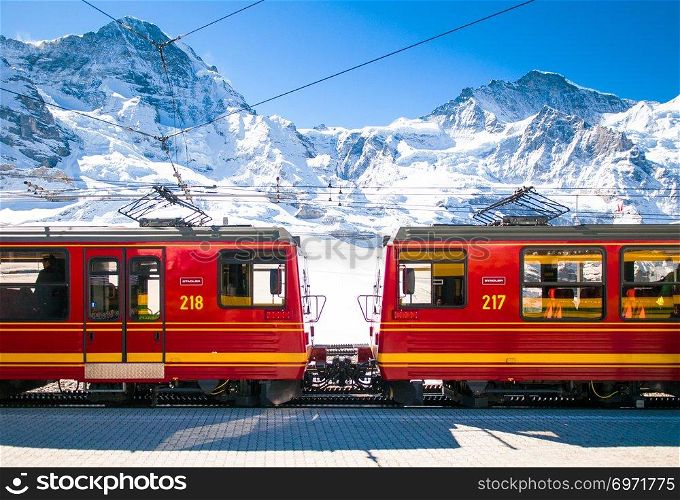 May 6, 2016 Kleine Scheidegg, Jungfrau region, Switzerland : Red train of Jungfrau Bahn at Kleine Scheidegg station. The main transportation to Jungfraujoch