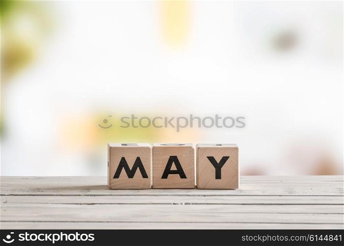 May word on wooden sign on a table