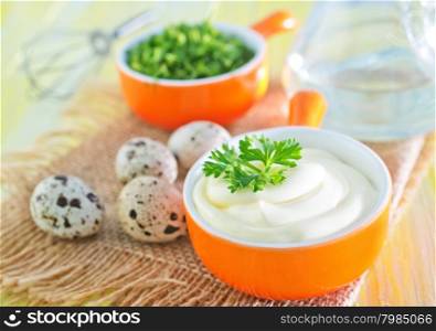 mayonnaise in bowl and on a table