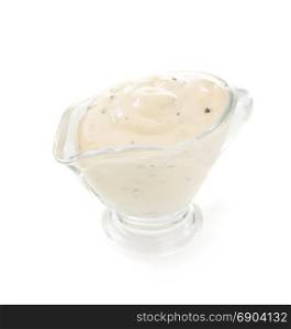 mayonnaise sauce in gravy boat isolated on white background