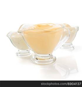 mayonnaise sauce in gravy boat isolated on white background