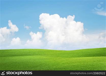 Meadow field hill with white clouds and blue sky, A beautiful summer landscape of the hills.