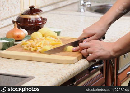 Meal preparation on kitchen from a potato