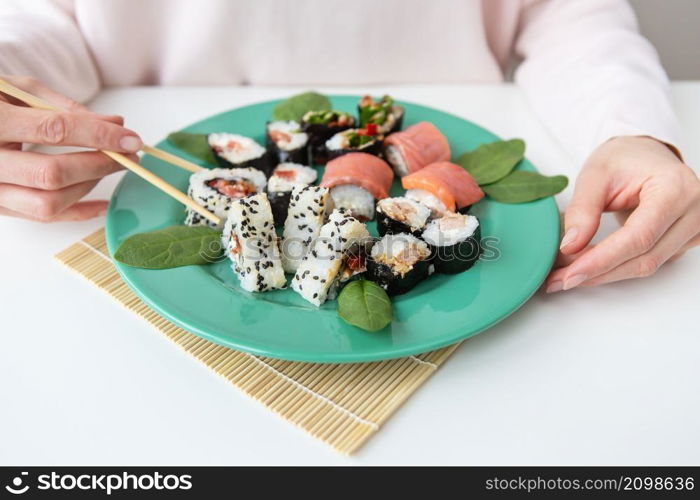 Meals, various types of maki sushi, philadelphia, maki, salmon, rice, salad Delicious and healthy food. Meals, various types of maki sushi, philadelphia, maki, salmon, rice, salad. Delicious and healthy food.