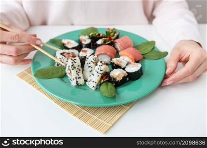 Meals, various types of maki sushi, philadelphia, maki, salmon, rice, salad Delicious and healthy food. Meals, various types of maki sushi, philadelphia, maki, salmon, rice, salad. Delicious and healthy food.