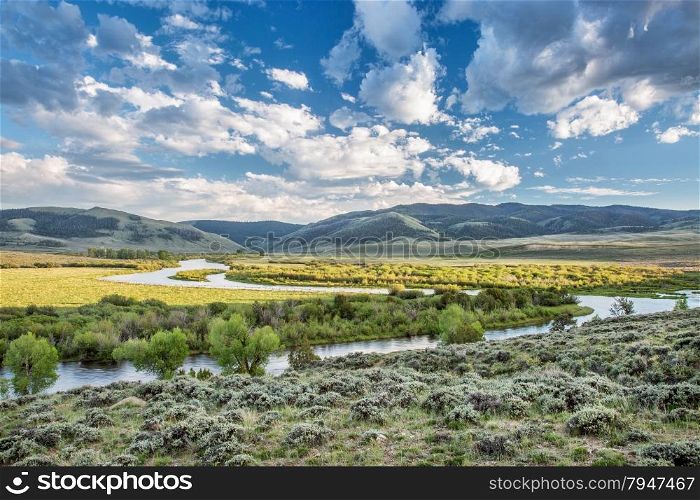 meanders of North Platte River above Northgate Canyon, North Park, Colorado - early summer scenery with partially cloudy sky