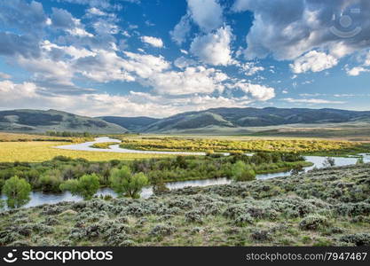 meanders of North Platte River above Northgate Canyon, North Park, Colorado - early summer scenery with partially cloudy sky