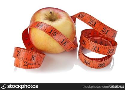 measure tape and apple isolated on white background
