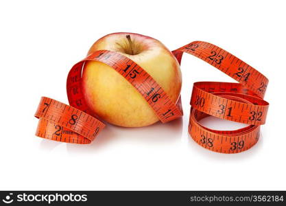 measure tape and apple isolated on white background