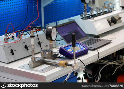 Measurement and control technology laboratory equipped with various instruments and systems.