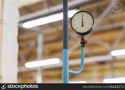 measuring devices concept - old barometer at industrial plant. old barometer at industrial plant