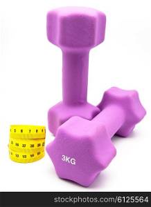 Measuring tape and and Pink dumbbells