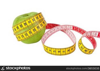 Measuring tape and fresh green apple on a white background