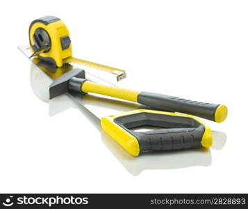 measuring tape and hammer on saw