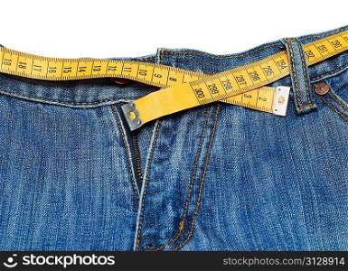 measuring tape around womans trousers