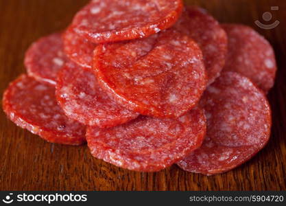 meat and sausages. different sausage and meat on a celebratory table with spices and vegetables