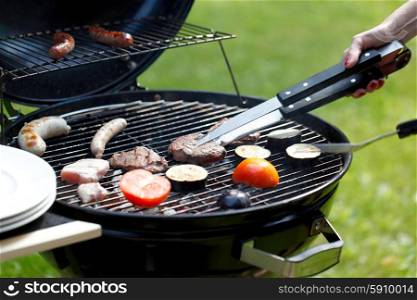 meat and sausages on grill