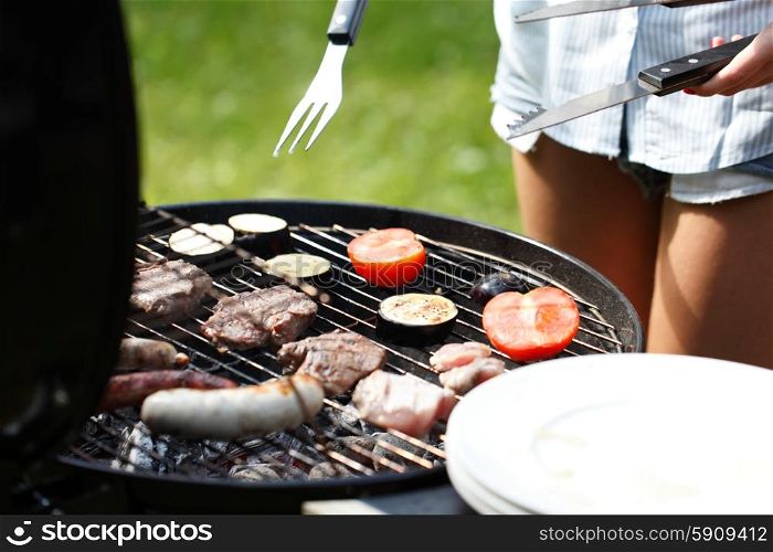meat and sausages on grill. meat and sausages cooked on grill